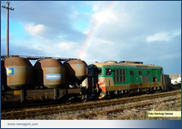 D3443.2026 nello scalo della stazione di Besana il 29/11/2002 dopo un violento acquazzone e con un arcobaleno che fa da sfondo alle manovre